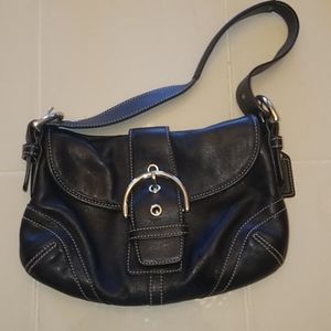 Black leather Coach fold over purse.